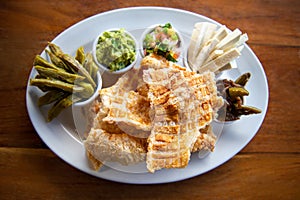 Mexican Pork rind. Nopales and guacamole. Mexican food on wooden background. Traditional Mexican food concept.