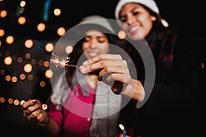 Mexican Posada latin female with sparklers, Christmas in Mexico