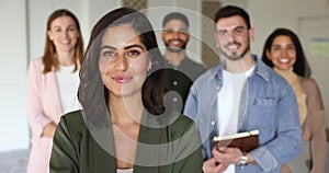 Mexican professional businesswoman, company boss and staff looking at camera