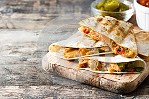 Mexican quesadilla with chicken, cheese and peppers photo