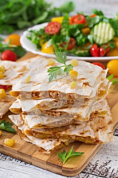 Mexican Quesadilla wrap with chicken, corn and sweet pepper