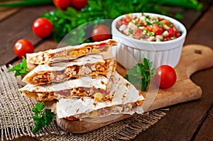 Mexican Quesadilla wrap with chicken, corn and sweet pepper photo