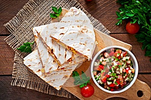 Mexican Quesadilla wrap with chicken, corn and sweet pepper photo