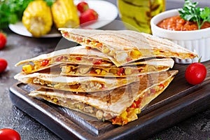 Quesadilla wrap with chicken, corn and sweet pepper and tomato sauce