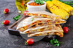 Quesadilla wrap with chicken, corn and sweet pepper and tomato sauce