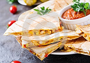 Quesadilla wrap with chicken, corn and sweet pepper and tomato sauce