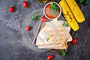 Mexican Quesadilla wrap with chicken, corn and sweet pepper and tomato sauce.