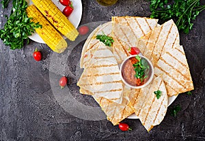 Mexican Quesadilla wrap with chicken, corn and sweet pepper and tomato sauce.