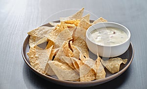 Mexican queso blanco cheese dip with corn tortilla chips photo