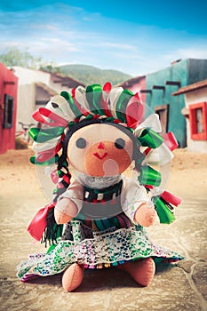 Mexican rag doll in a traditional dress on a mexican village