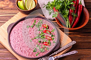 Mexican red bean puree soup with lime, parsley and chilli pepper