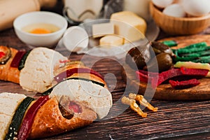 Mexican rosca de reyes or Epiphany cake ingredients and recipe on a wooden table in Mexico Latin America