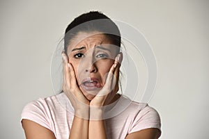 Mexican sad woman serious and concerned crying desperate overacting on feeling depressed