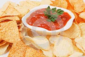 Mexican salsa with corn and potato chips
