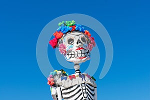 Mexican sculpture of a skeleton dressed as a high class lady. Dia de los Muertos, The Day of the Dead, colorful sculpture