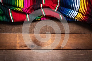 Mexican Serape blanket on wood Background