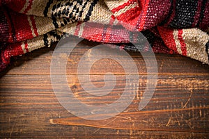 Mexican Serape blanket on wood Background