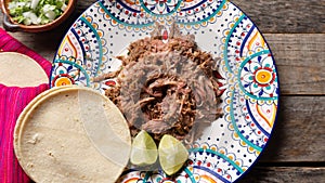 Mexican slow cooked lamb also called barbacoa on wooden background photo