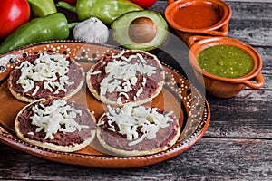 Mexican sopes with grated cheese and fried beans, Traditional breakfast in Mexico