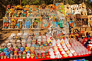 Mexican Souvenirs in the market for tourists. Colorful skulls, pyramids and Mayan masks. Mexico