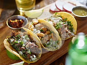 Mexican street tacos with barbacoa, carnitas and ChicharrÃÂ³n photo