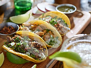 Mexican street tacos in yellow tortilla with beef and pork