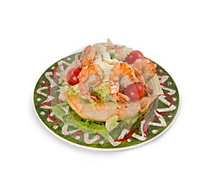 Mexican style of salads with shrimps, salmon, lemon and lettuce