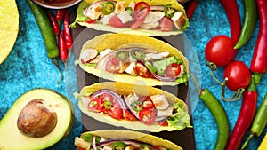 Mexican taco with chicken meat, jalapeno, fresh vegetables served with guacamole