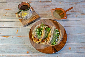 Mexican tacos with barbecue, green sauce and cafe de la olla photo