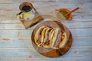 tacos with barbecue, green sauce and cafe de la olla photo