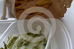 Mexican takeaway: Empty Box of Guacamole and Nachos