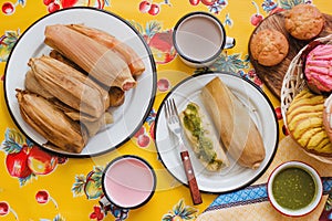 Mexican tamales of corn leaves with green sauce and atole, Tamales Breakfast in Mexico