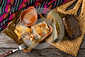 Mexican tamales wrapped in banana leaves also called OaxaqueÃÂ±os photo