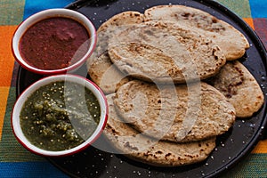 Mexican tlacoyos with green and red sauce, Traditional food in Mexico photo