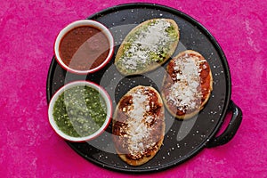 Mexican tlacoyos with green and red sauce, Traditional food in Mexico photo