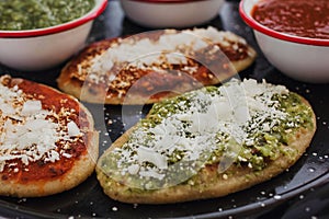 Mexican tlacoyos with green and red sauce, Traditional food in Mexico