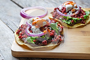 Mexican tortilla toast with chorizo also called tostadas