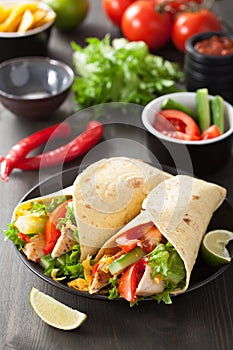 Mexican tortilla wrap with chicken breast and vegetables