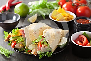 Mexican tortilla wrap with chicken breast and vegetables