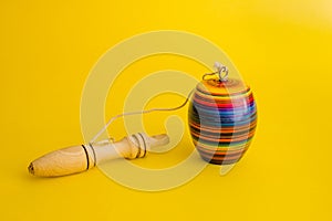 Mexican toys, Balero from Wooden in Mexico on yellow background photo