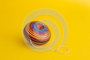 Mexican toys, yoyo from Wooden in Mexico on yellow background photo