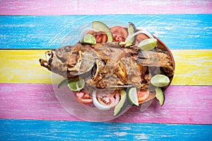 Fried fish on colorful background
