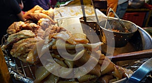 Pork meat and skin in a street food tent photo