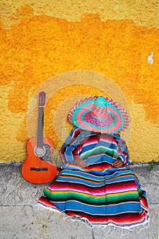 Mexican typical lazy man hat guitar serape photo