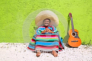 Mexican typical lazy topic man guitar poncho sit