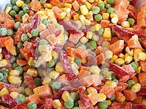 Mexican vegetable mixture. Pieces of pepper, carrots, corn and green peas. A colorful mix of the freshest and hottest vegetables photo