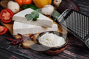 Mexican white Cotija cheese, tequila shot with fresh ingredients in Mexico Latin America