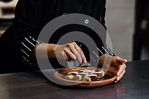 Mexican woman cooking mole poblano enchiladas traditional food in a restaurant in Mexico