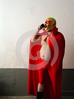 Mexican wrestler drinking coffee
