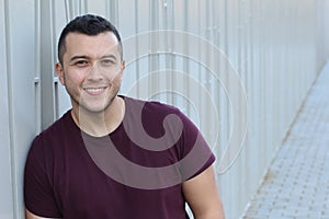 Mexican young man smiling with copy space